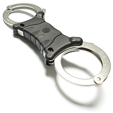 Ergonomic grip to aid handcuff orientation